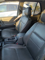 Interior of a 2001 Honda Passport EX with worn black leather seats and a center console.