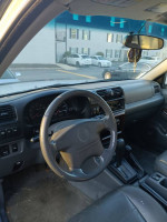 Interior view of a 2001 Honda Passport EX showcasing the steering wheel and dashboard details.