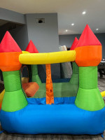 Bounceland Castle Bounce House with Hoop and Slide
